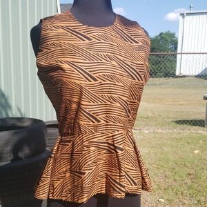 Sleeveless Peplum Blouse in Brown with Black Print